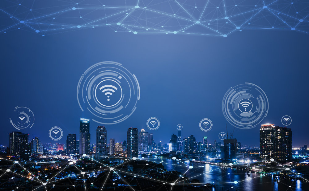 A digital illustration of a city skyline with interconnected lines symbolizing internet connectivity throughout the urban landscape.