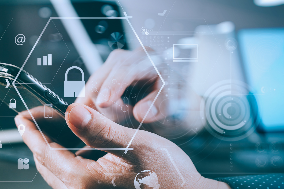 A person holding a smartphone displaying various security icons, symbolizing digital security and protection.